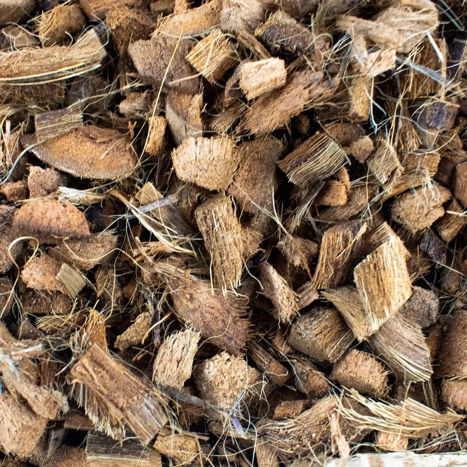 Coconut husk chips on white background, product photo 3.