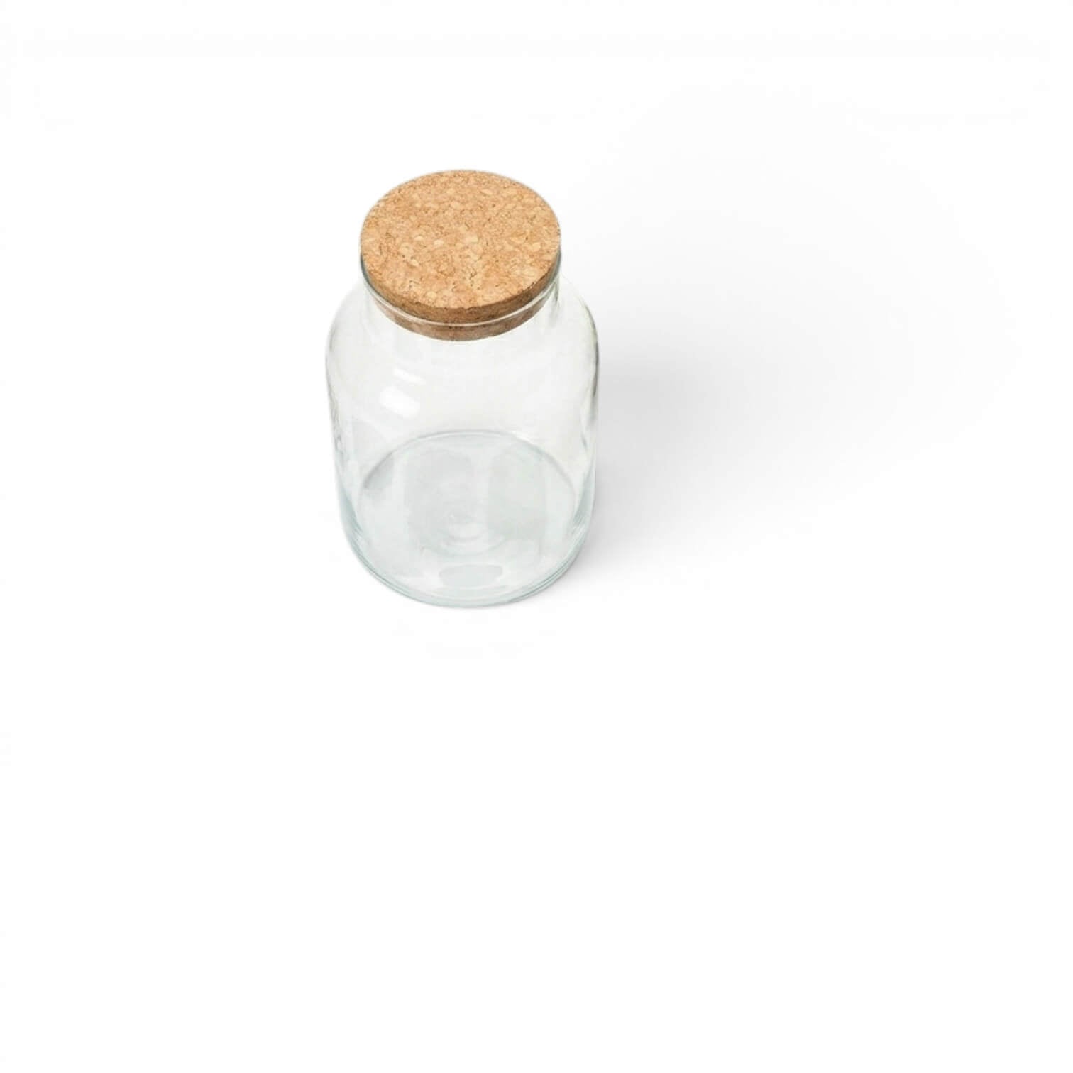 Clear glass jar with a cork lid on a white background
