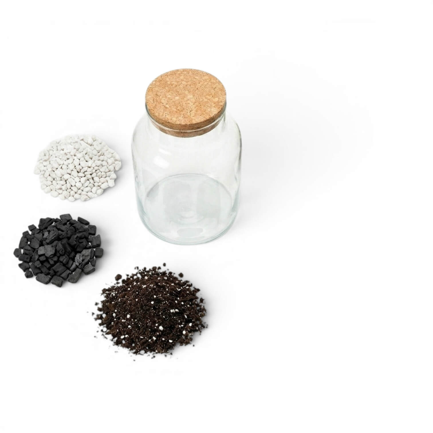 Clear glass jar with cork lid surrounded by small piles of substrates, gravel, activated carbon and soil on a white background