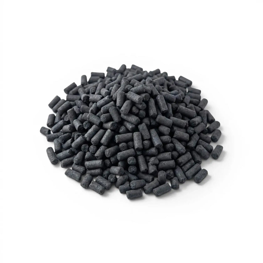 Pile of black activated carbon pellets on a white background