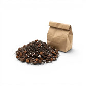 Anthurium potting mix next to a brown paper bag on a white background