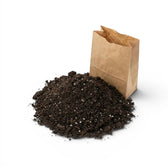 Brown paper bag filled with base potting mix on a white background