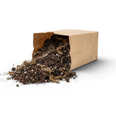 Brown paper bag filled with carnivorous potting mixon a white background