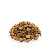 Pile of brown coconut coir chips on a white background