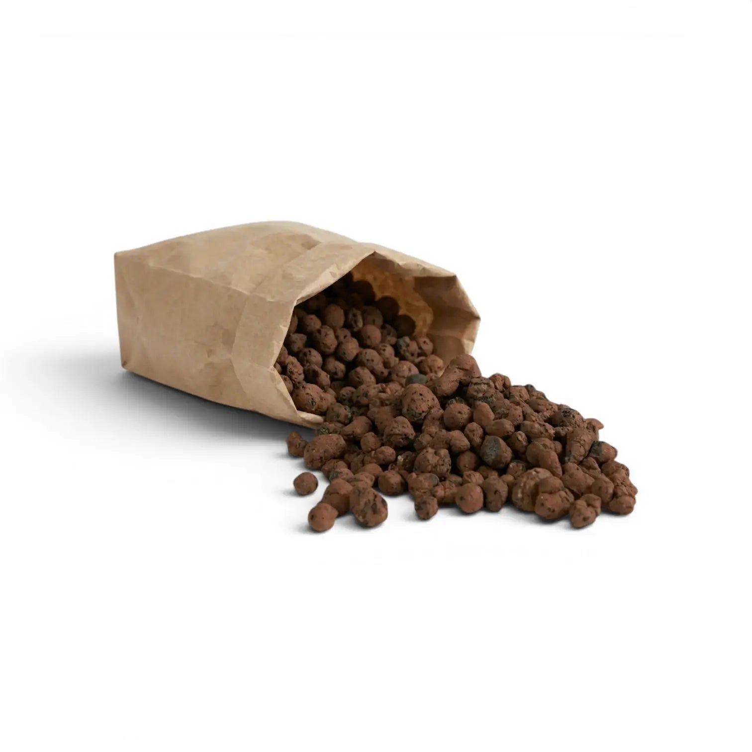 Brown paper bag with spilled brown expanded clay pebbles on a white background