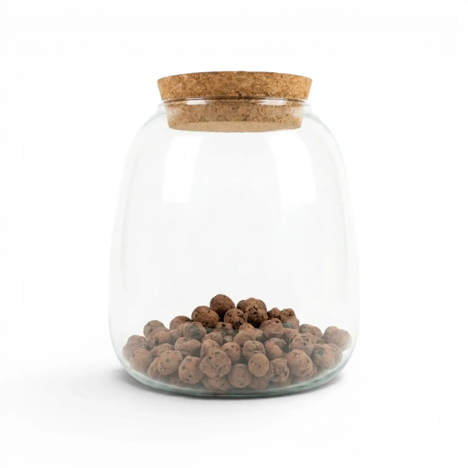Clear glass jar with cork lid containing expanded clay pebbles on a white background