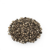 Pile of lithops potting mix on a white background