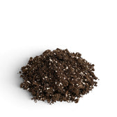 Heap of dark brown seedling soil mix on a white background