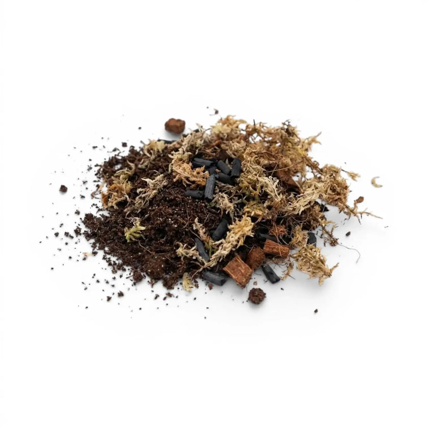 Heap of terrarium potting mix on a white background