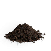 Pile of dark brown worm castings on a white background
